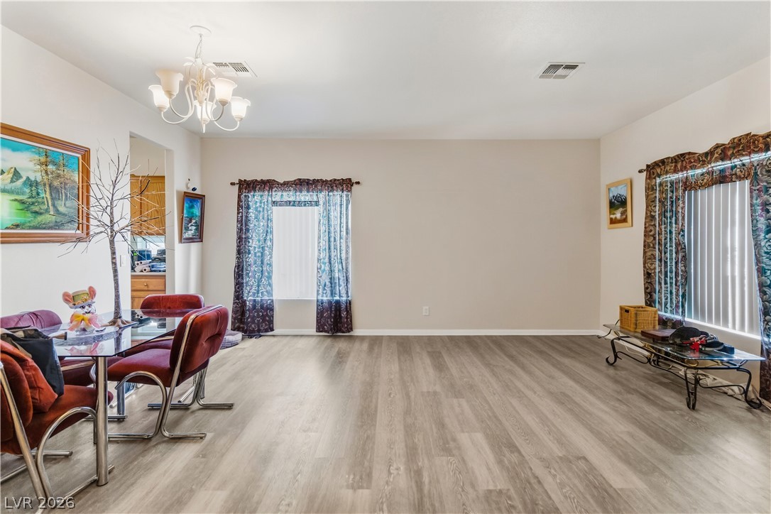 2823 Rippling Springs Street Laughlin, NV 89029 - Photo 6 of 89 Family Room featuring light wood-type flooring and suspended lighting
