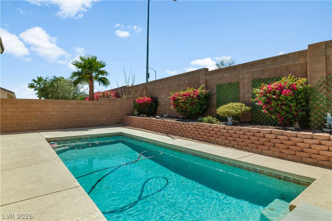 2823 Rippling Springs Street Laughlin, NV 89029 - Photo 62 of 89 View of pool with patio surround and a fenced backyard