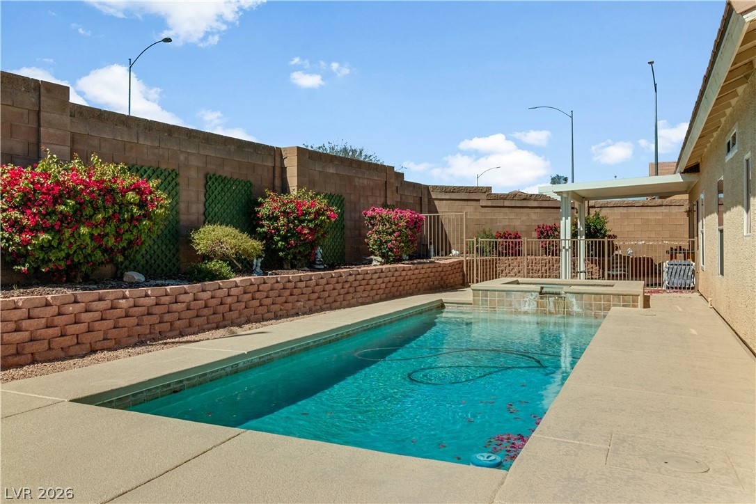2823 Rippling Springs Street Laughlin, NV 89029 - Photo 63 of 89 Combined pool / hot tub with a patio and a fenced backyard
