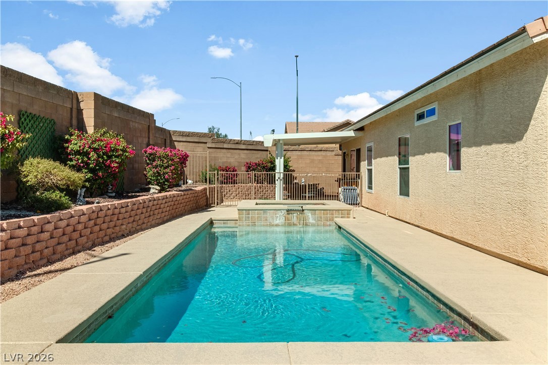 2823 Rippling Springs Street Laughlin, NV 89029 - Photo 64 of 89 Relaxing pool / spa featuring a patio and a fenced backyard