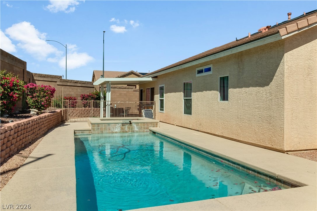 2823 Rippling Springs Street Laughlin, NV 89029 - Photo 65 of 89 Integrated pool / hot tub featuring a fenced backyard and a patio area