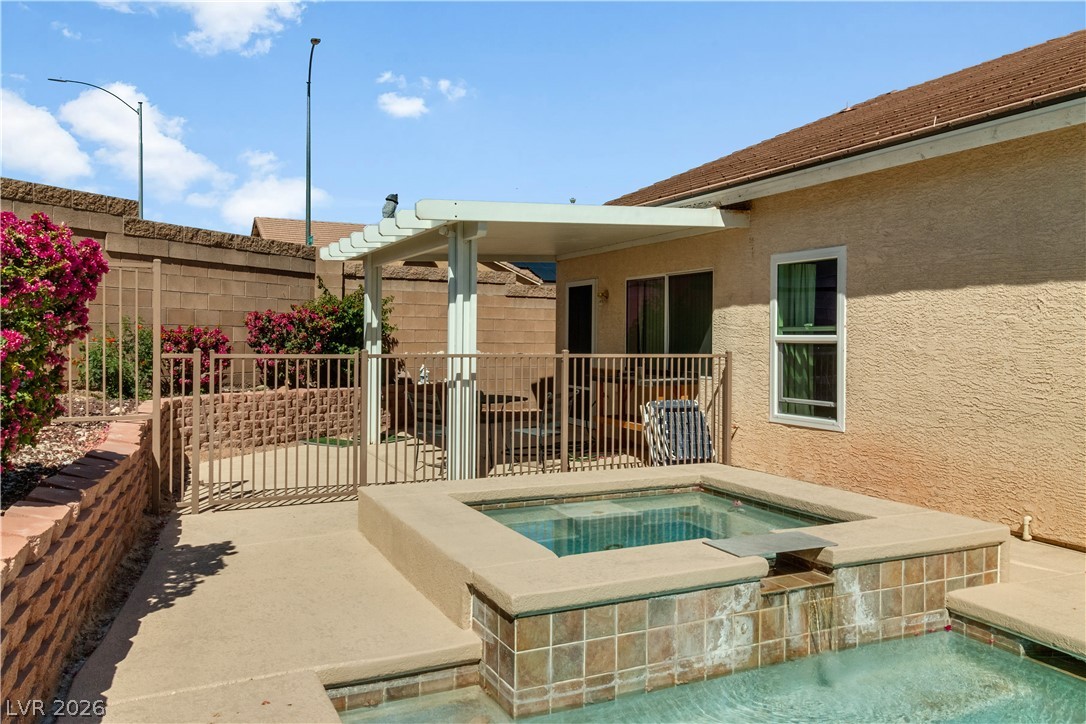 2823 Rippling Springs Street Laughlin, NV 89029 - Photo 70 of 89 View of pool with patio surround, an in-ground hot tub, and a pool