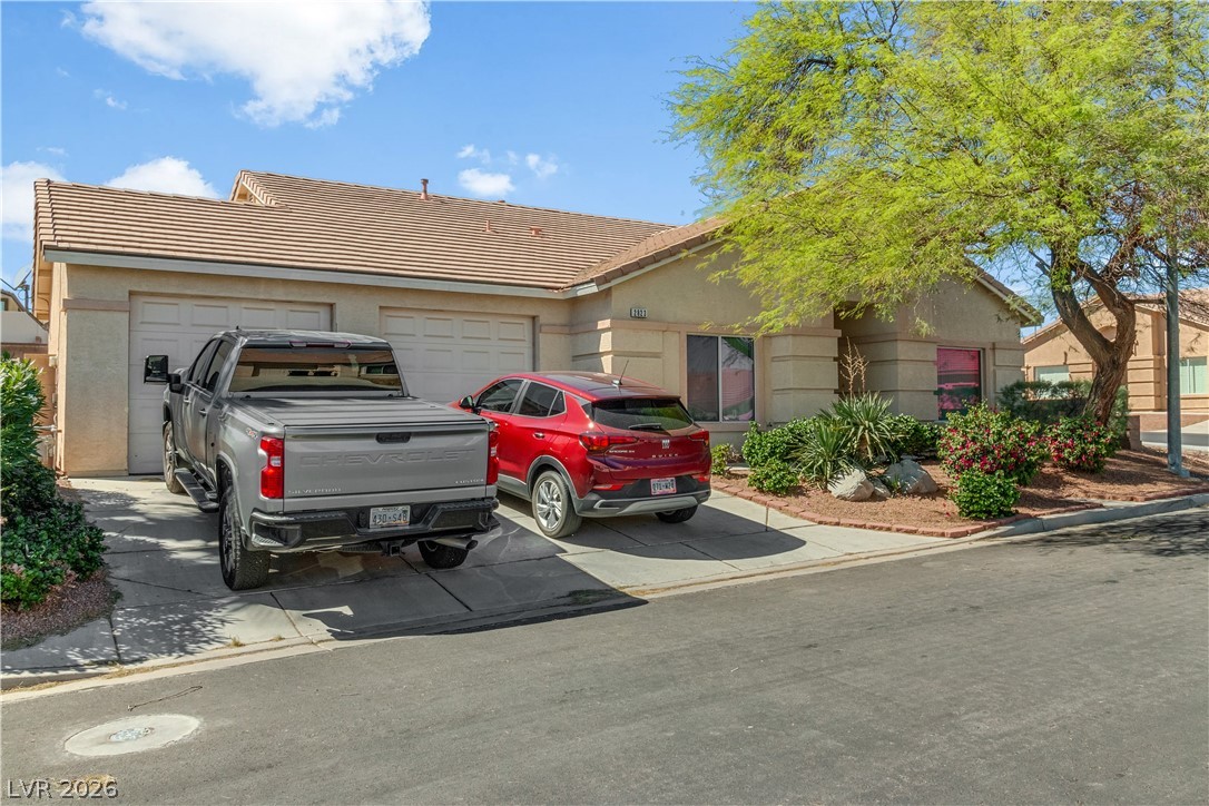 2823 Rippling Springs Street Laughlin, NV 89029 - Photo 71 of 89 View of front of property with a tile roof, stucco siding, and driveway