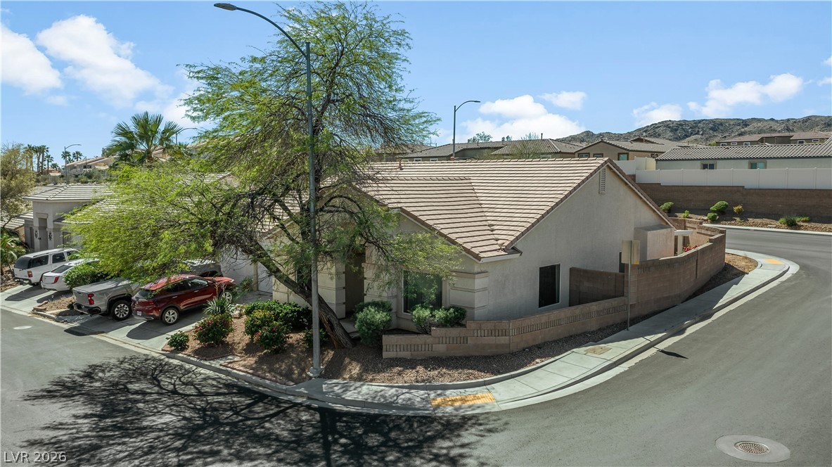 2823 Rippling Springs Street Laughlin, NV 89029 - Photo 78 of 89 View of property exterior with a tiled roof, stucco siding, and a residential view