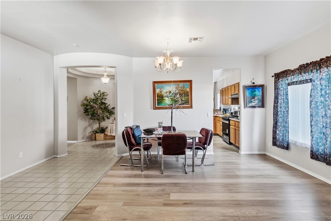 2823 Rippling Springs Street Laughlin, NV 89029 - Photo 8 of 89 Family Room with light wood finished floors and suspended lighting