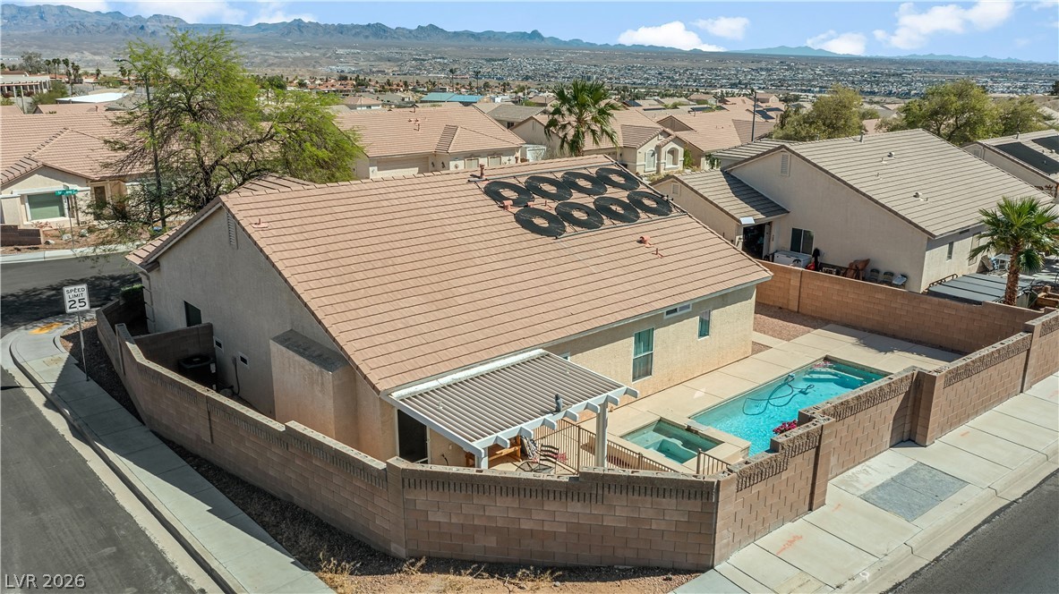 2823 Rippling Springs Street Laughlin, NV 89029 - Photo 87 of 89 Aerial perspective of suburban area featuring a pool area and mountains