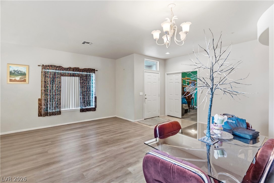 2823 Rippling Springs Street Laughlin, NV 89029 - Photo 10 of 89 Family Room with wood finished floors and suspended lighting