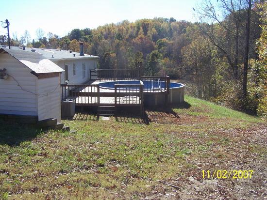 275 Ledbetter Road Rocky Mount, VA 24151 - Photo 2 of 2 a view of a roof deck with wooden fence and a bench