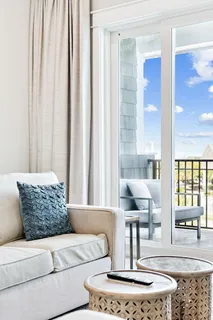 a bedroom with a flat screen television and a bed