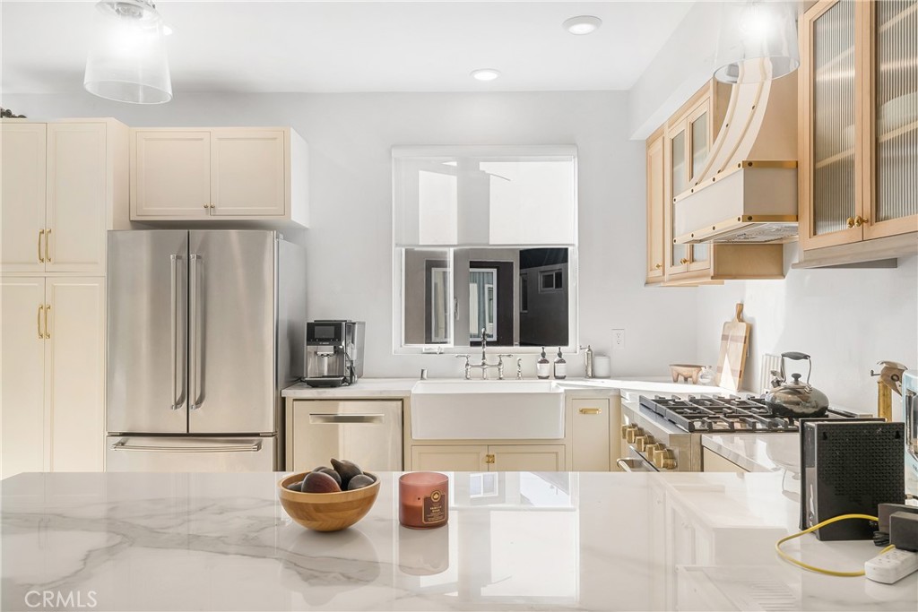 2581 Arvia Street, Unit 3 Los Angeles, CA 90065 - Photo 11 of 52 a living room with stainless steel appliances kitchen island granite countertop a sink and cabinets