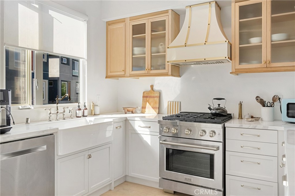 2581 Arvia Street, Unit 3 Los Angeles, CA 90065 - Photo 12 of 52 a kitchen with stainless steel appliances granite countertop a stove sink and cabinets