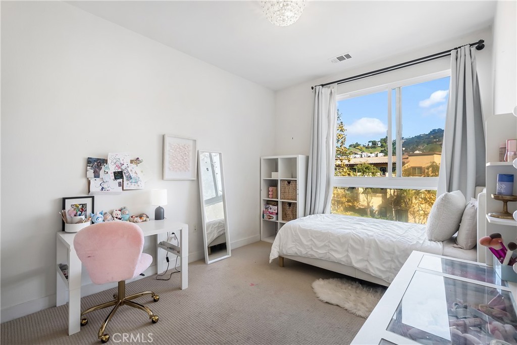 2581 Arvia Street, Unit 3 Los Angeles, CA 90065 - Photo 19 of 52 a bedroom with a bed chair and window