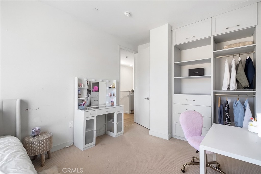 2581 Arvia Street, Unit 3 Los Angeles, CA 90065 - Photo 20 of 52 a living room with furniture a flat screen tv and a refrigerator
