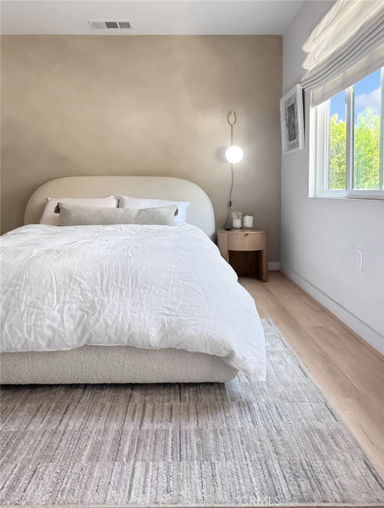 2581 Arvia Street, Unit 3 Los Angeles, CA 90065 - Photo 24 of 52 a large bed sitting in a bedroom next to a window