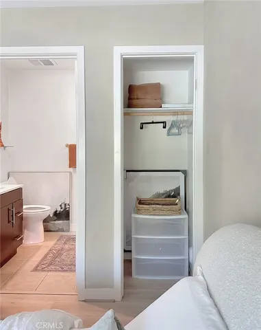 a view of a livingroom with furniture and a potted plant
