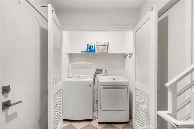 a bathroom with a granite countertop toilet a sink and mirror
