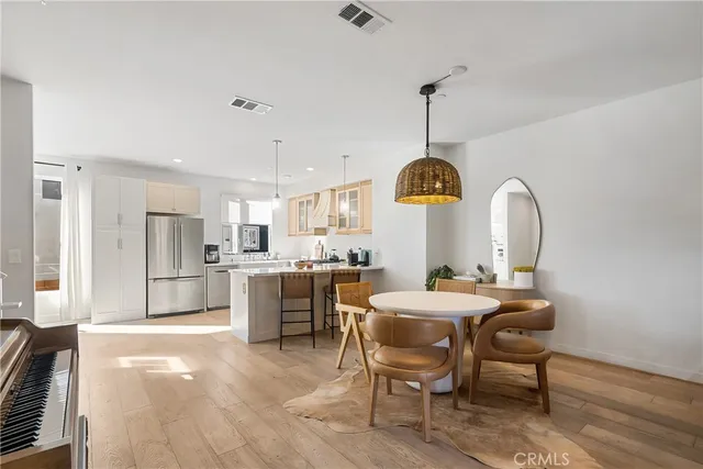 a living room with furniture and a book shelf