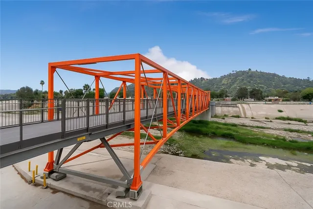 a view of a house with a yard balcony and sitting area
