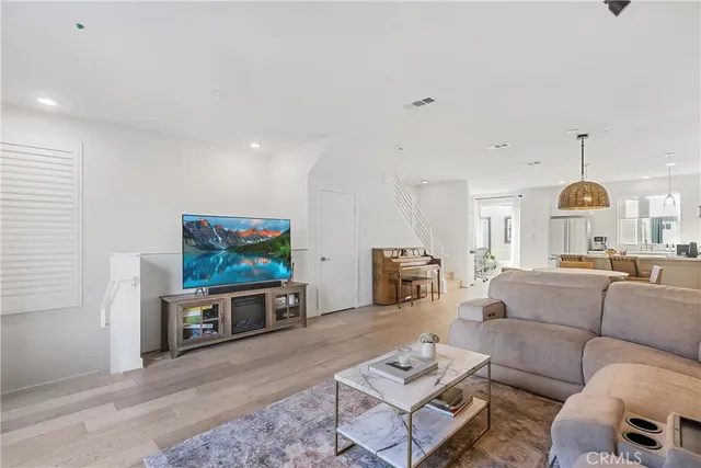 a dining room with furniture a window and kitchen view