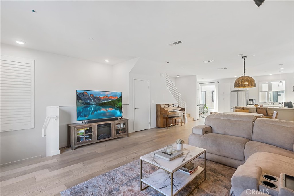 2581 Arvia Street, Unit 3 Los Angeles, CA 90065 - Photo 5 of 52 a living room with furniture and a flat screen tv