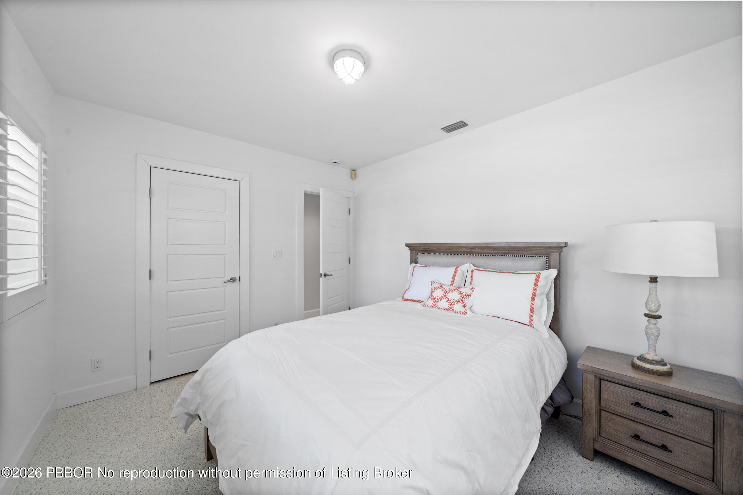 2259 Ibis Isle Road East, Unit E Palm Beach, FL 33480 - Photo 13 of 28 a bedroom with a bed and a night stand