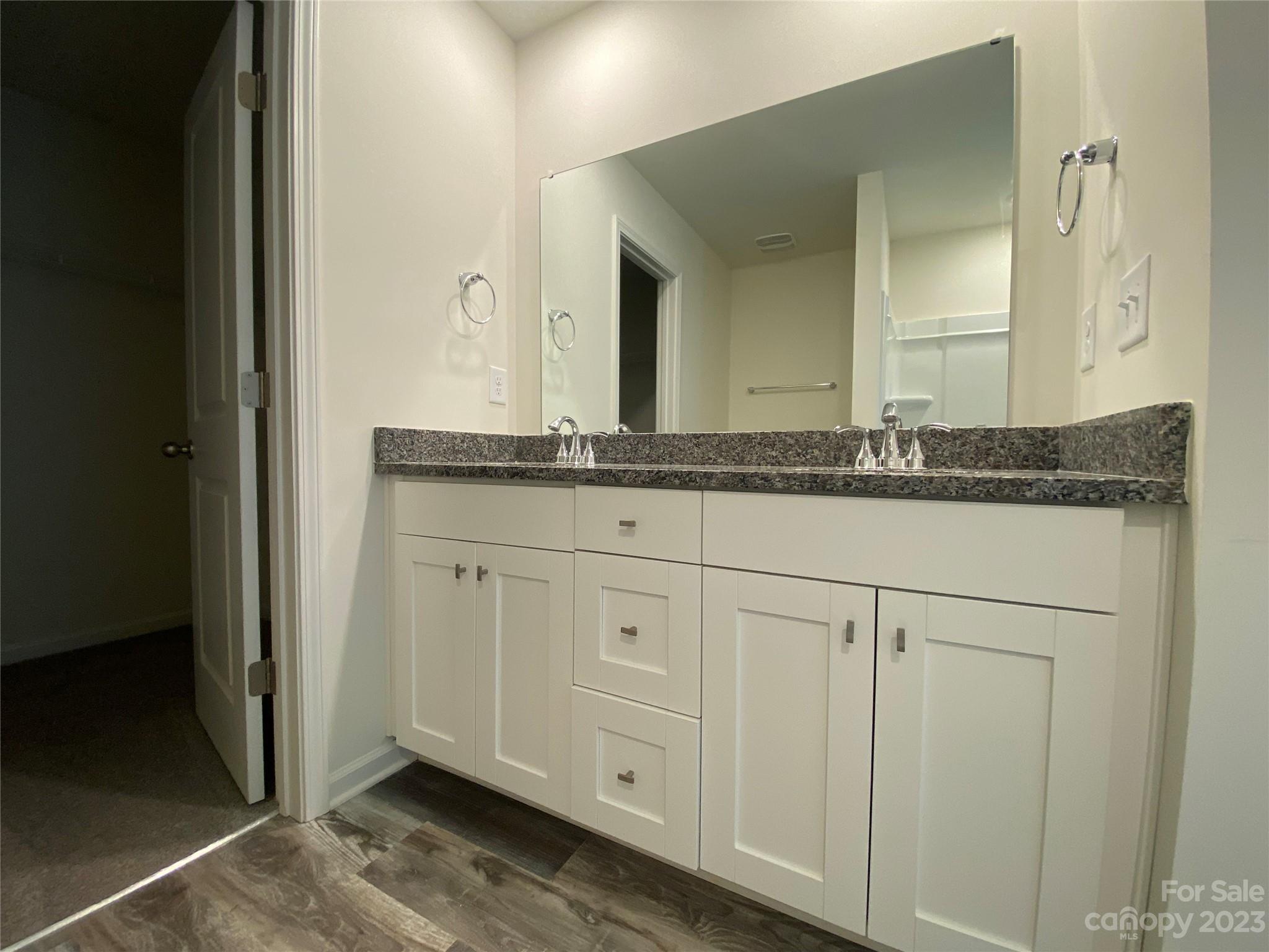 345 Corinth Church Road Mount Ulla, NC 28125 - Photo 11 of 12 a bathroom with a granite countertop sink and a mirror