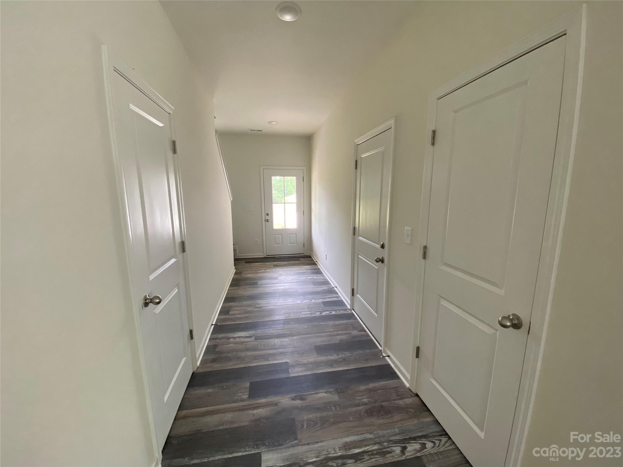345 Corinth Church Road Mount Ulla, NC 28125 - Photo 2 of 12 a view of a hallway with wooden floor and staircase