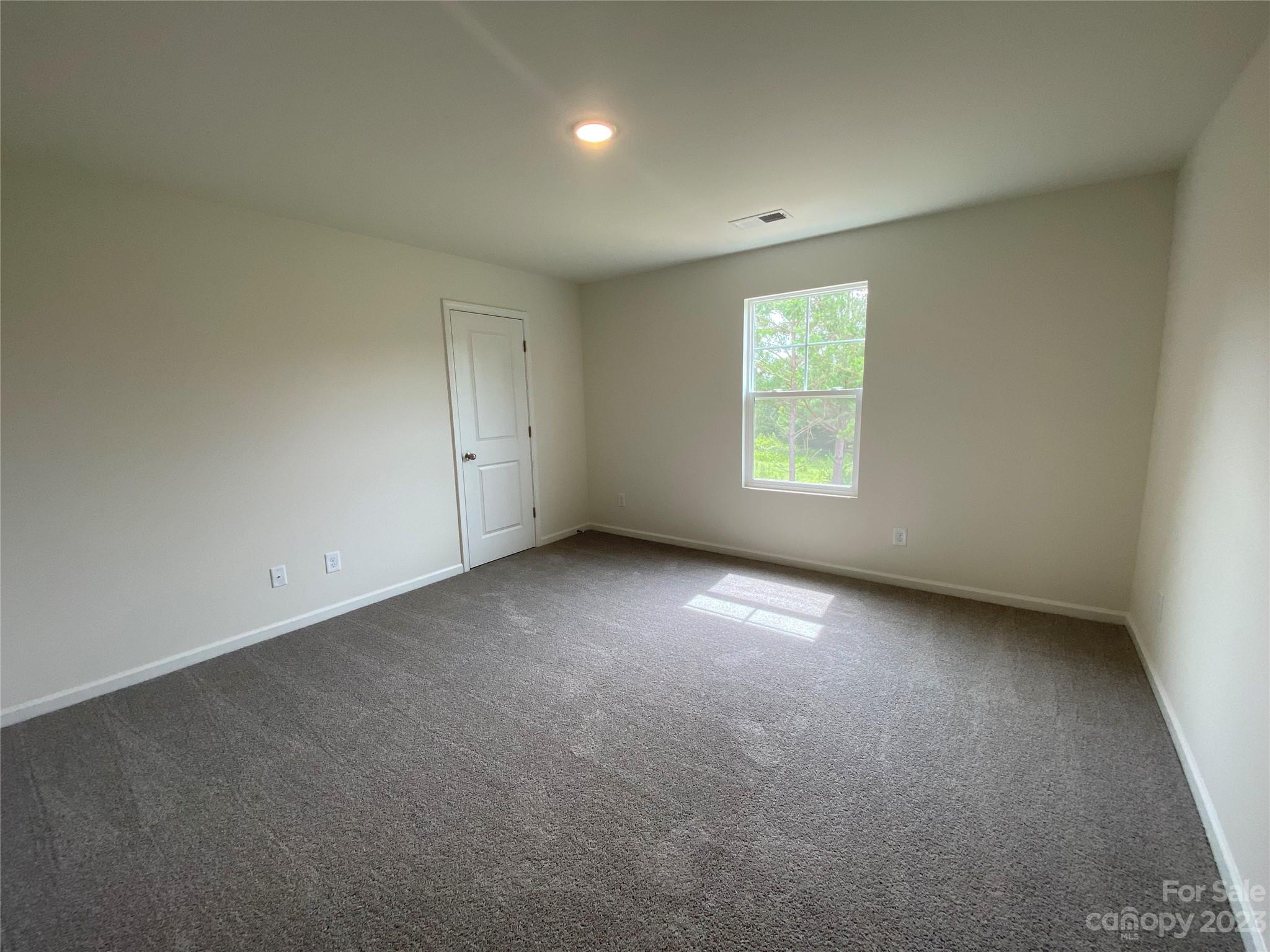 345 Corinth Church Road Mount Ulla, NC 28125 - Photo 5 of 12 a view of an empty room with a window