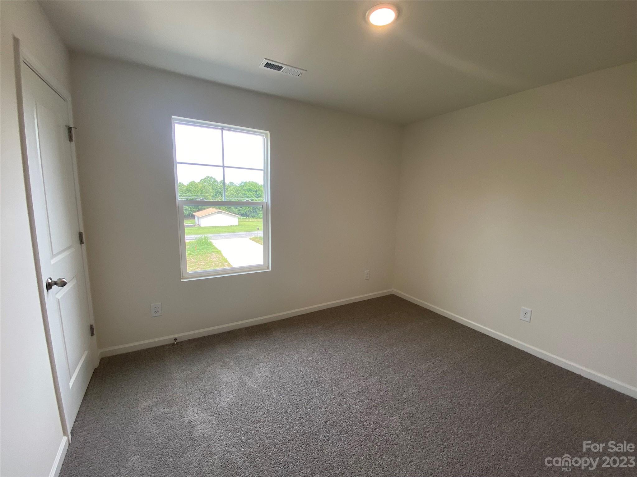 345 Corinth Church Road Mount Ulla, NC 28125 - Photo 6 of 12 an empty room with a window