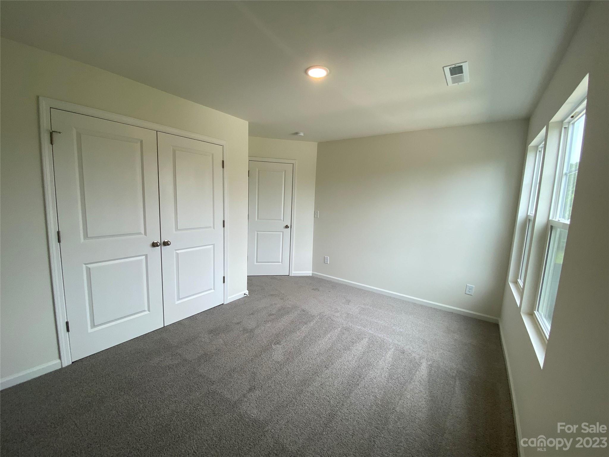 345 Corinth Church Road Mount Ulla, NC 28125 - Photo 7 of 12 an empty room with windows
