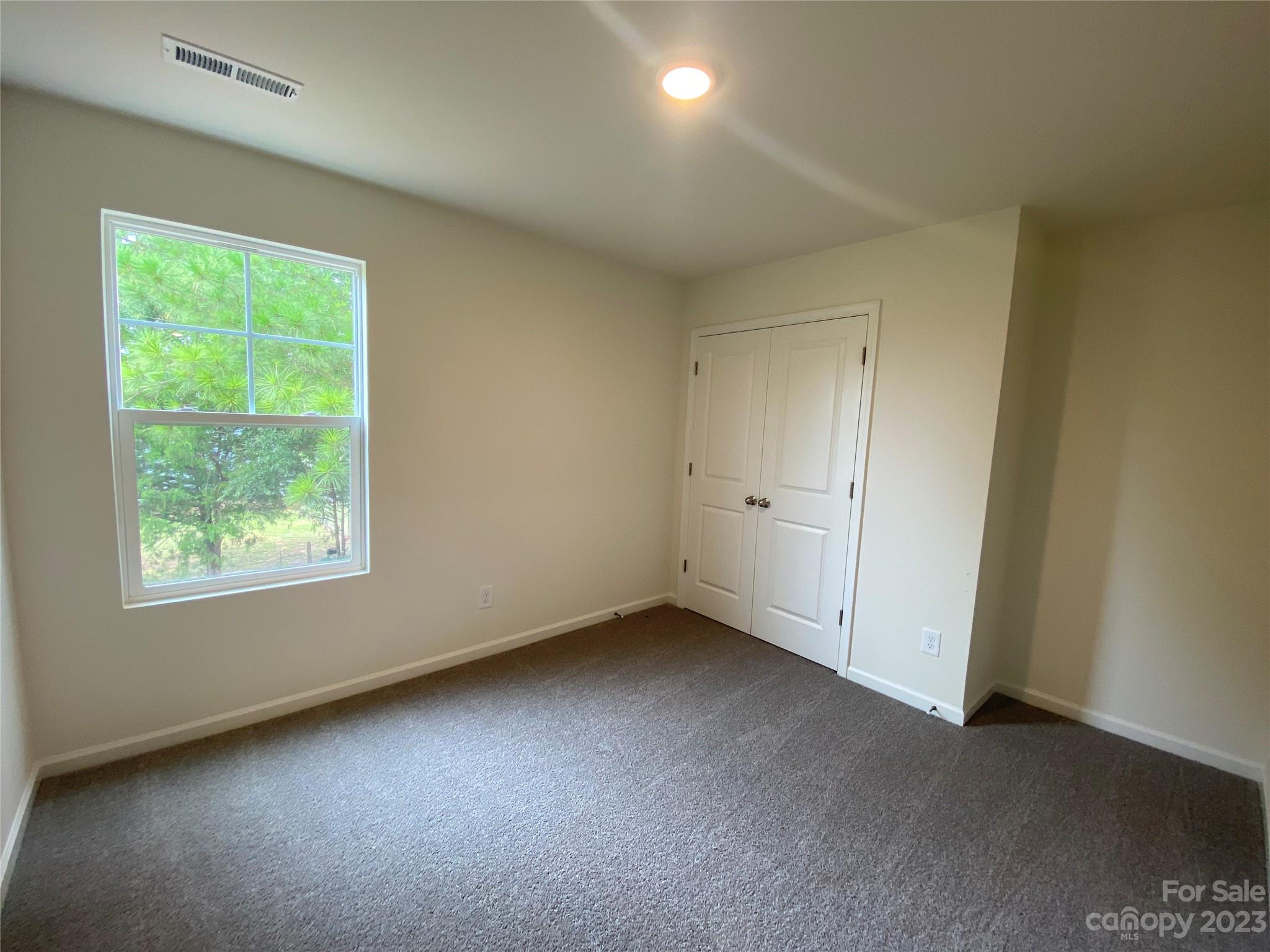 345 Corinth Church Road Mount Ulla, NC 28125 - Photo 8 of 12 an empty room with a window