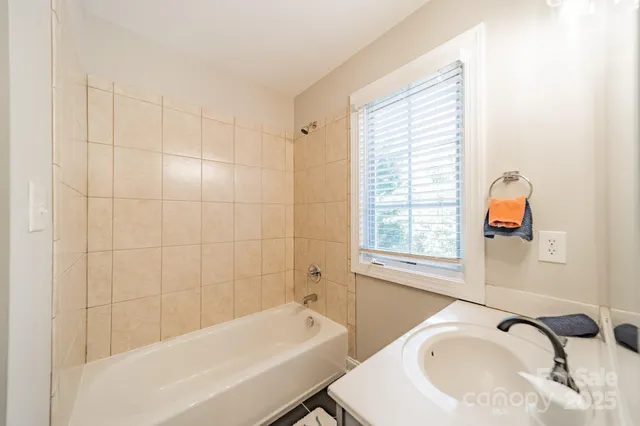 a bathroom with a sink and a bathtub