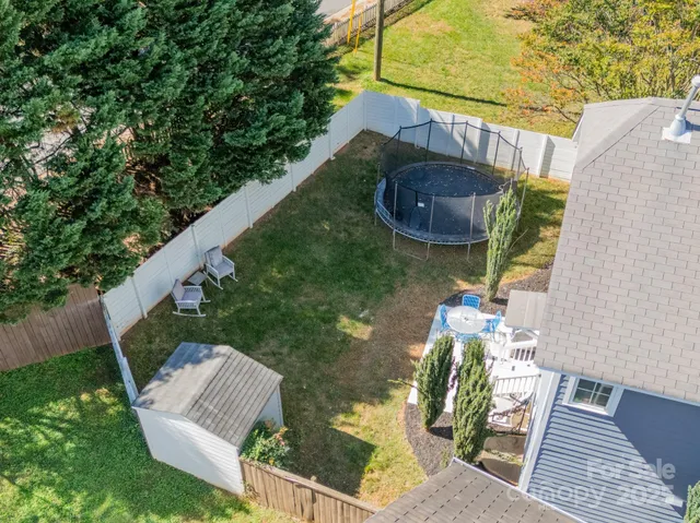 a view of yard from deck having patio