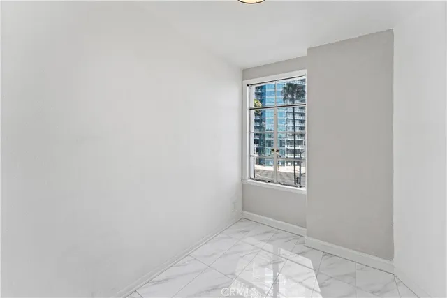 a view of an empty room with windows