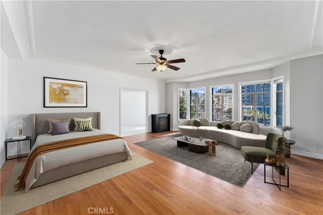 a spacious bedroom with a bed and a couch