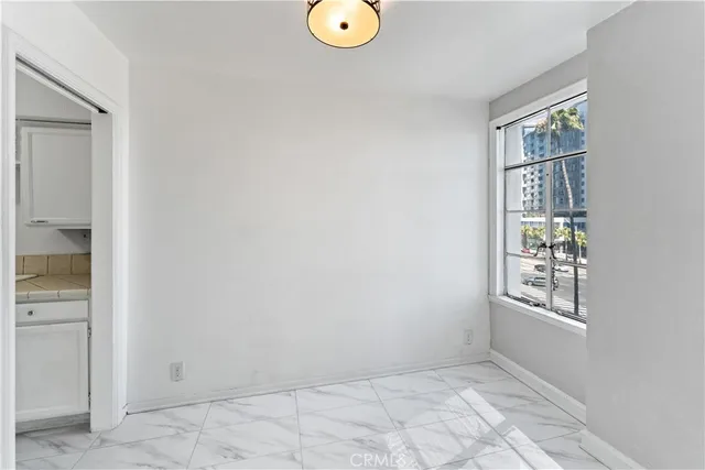 a view of an empty room with windows