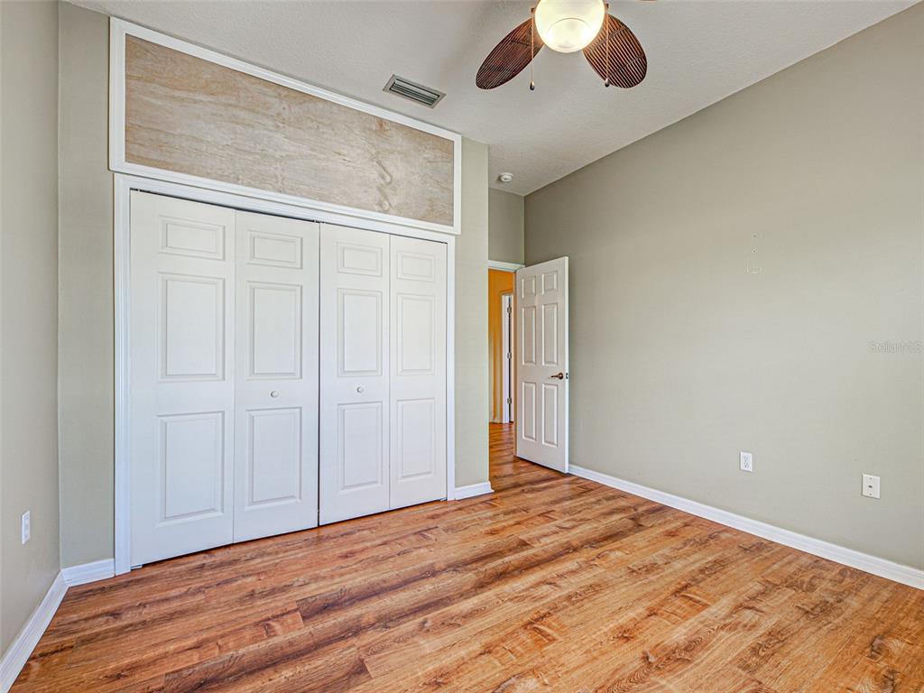 1801 Highland Road Osprey, FL 34229 - Photo 27 of 40 a view of empty room with wooden floor