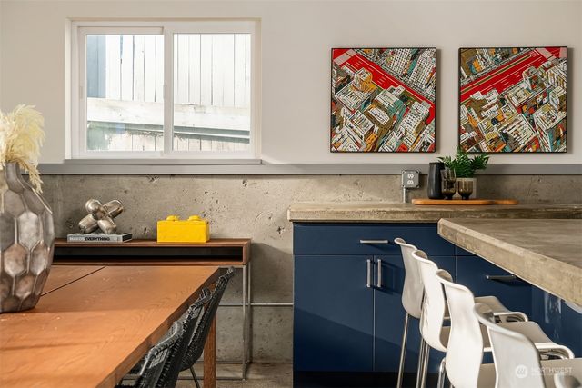 a kitchen with stainless steel appliances cabinets and a window