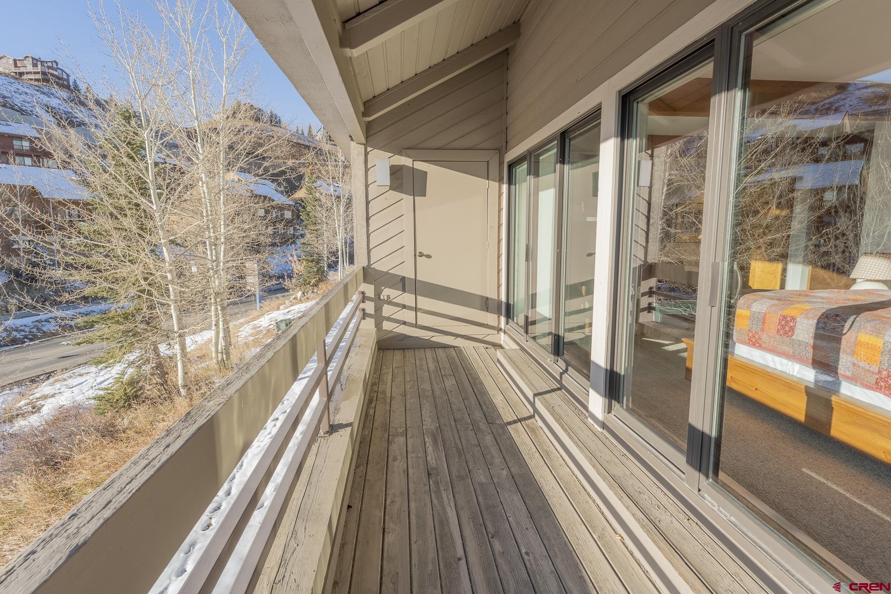 11 Hunter Hill Road, Unit 307 Crested Butte, CO 81225 - Photo 20 of 34 a view of balcony with wooden floor