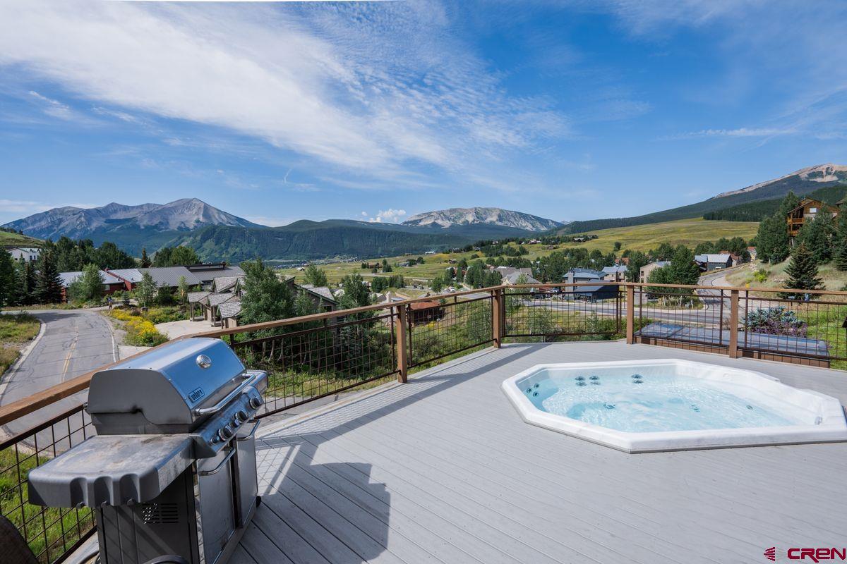 11 Hunter Hill Road, Unit 307 Crested Butte, CO 81225 - Photo 2 of 34 a view of a swimming pool with a lounge chair
