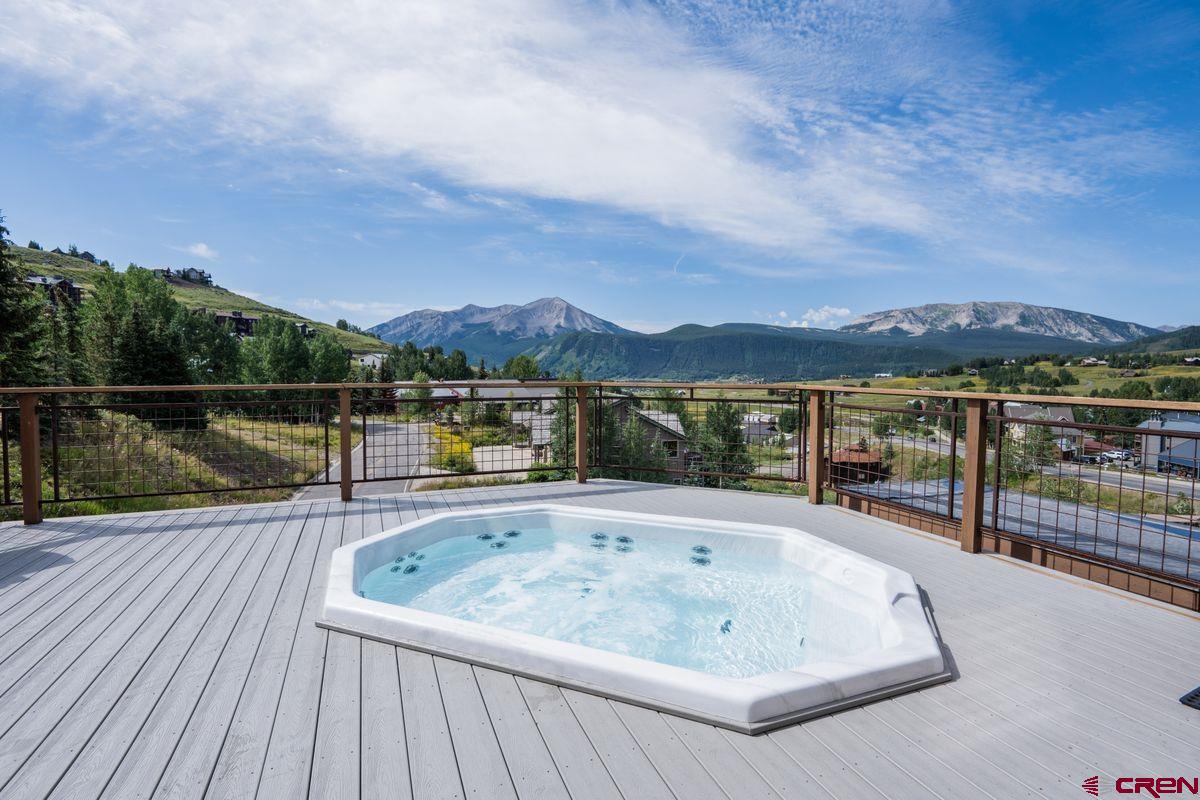 11 Hunter Hill Road, Unit 307 Crested Butte, CO 81225 - Photo 30 of 34 a view of swimming pool with a table and chairs