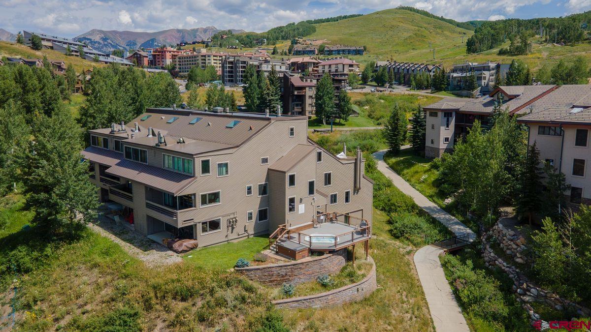 11 Hunter Hill Road, Unit 307 Crested Butte, CO 81225 - Photo 3 of 34 an aerial view of a house with a garden