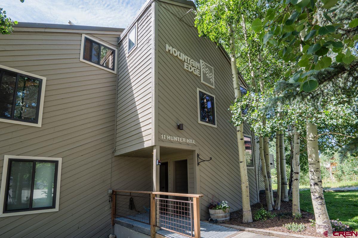 11 Hunter Hill Road, Unit 307 Crested Butte, CO 81225 - Photo 32 of 34 a view of a house with a tree