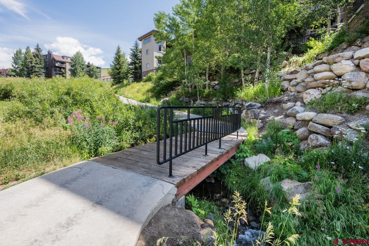 11 Hunter Hill Road, Unit 307 Crested Butte, CO 81225 - Photo 33 of 34 a view of a garden with wooden fence