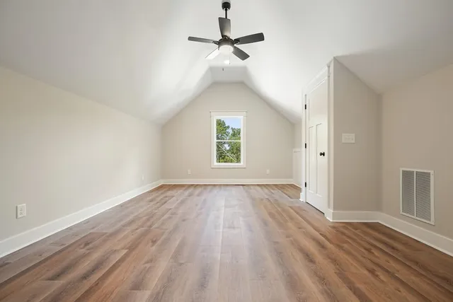 a view of an house with backyard space and a kitchen