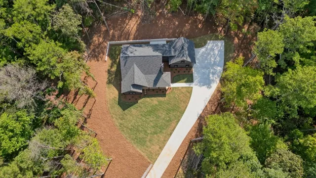a bird view of a house with a tree
