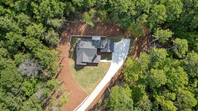 a view of a lush green hillside and a houses