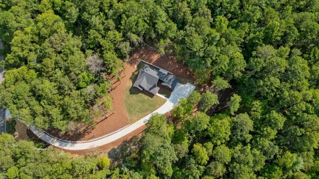an aerial view of residential house and green space