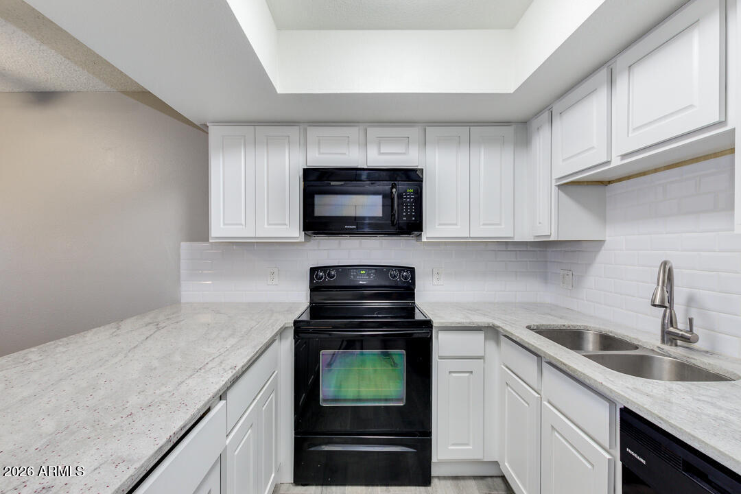 2149 East 10th Street, Unit 3 Tempe, AZ 85281 - Photo 4 of 14 a kitchen with a sink and a stove top oven