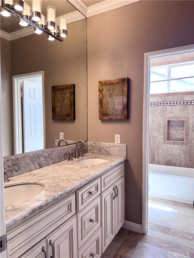 28463 Cascade Road Castaic, CA 91384 - Photo 26 of 29 a bathroom with a granite countertop double vanity sink a mirror and shower